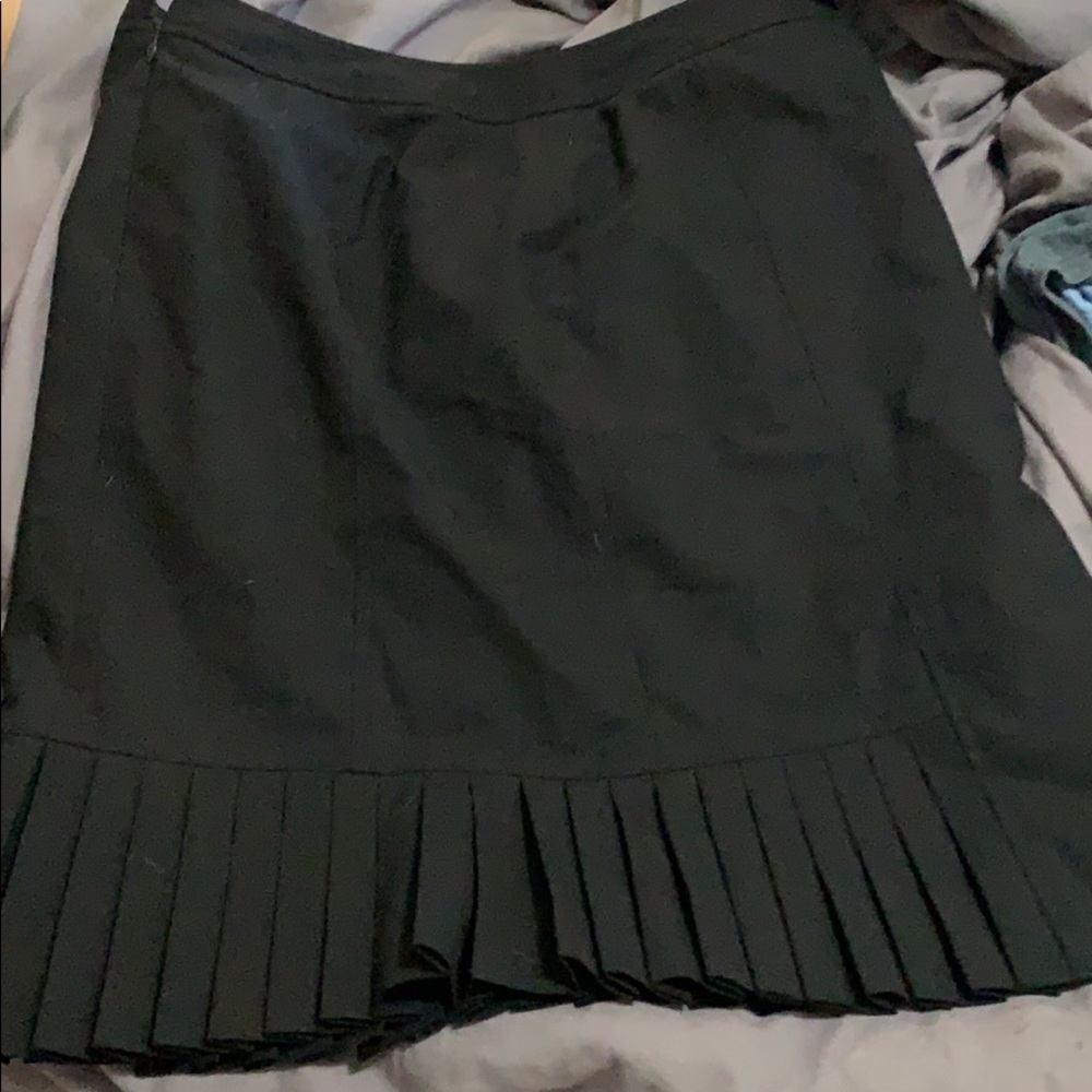 Black pleated knee length skirt